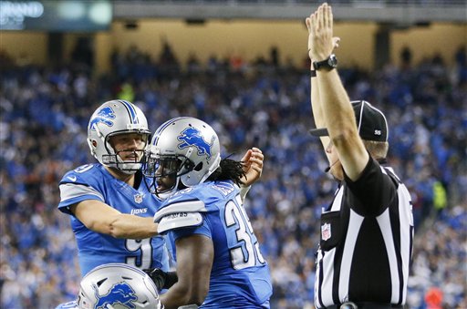 Matthew Stafford felicita a Joique Bell 