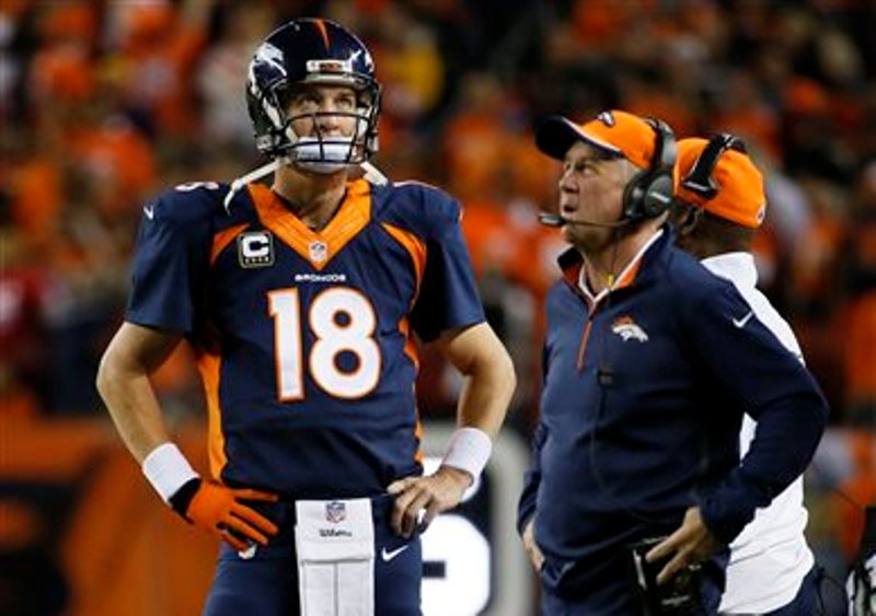 Manning y el entrenador John Fox