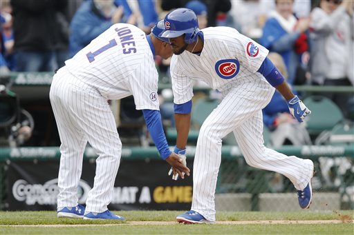 Dexter Fowler y Gary Jones  celebran el triunfo 