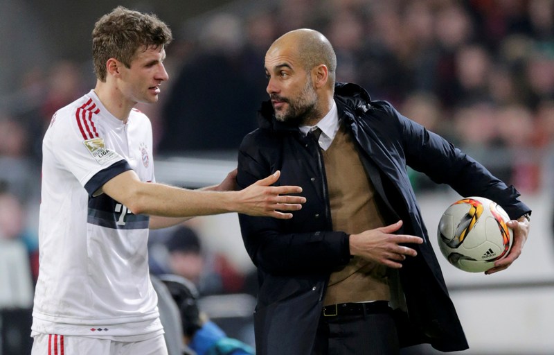 Thomas Muller y Pep Guardiola