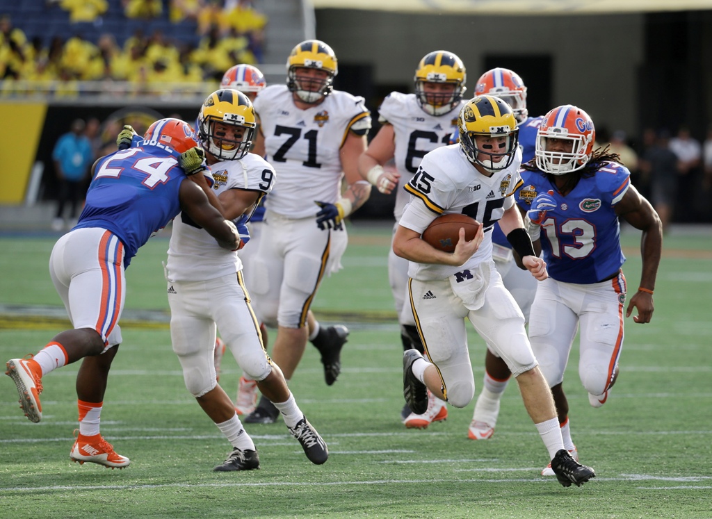 Jake Rudock (15), quarterback de Michigan 