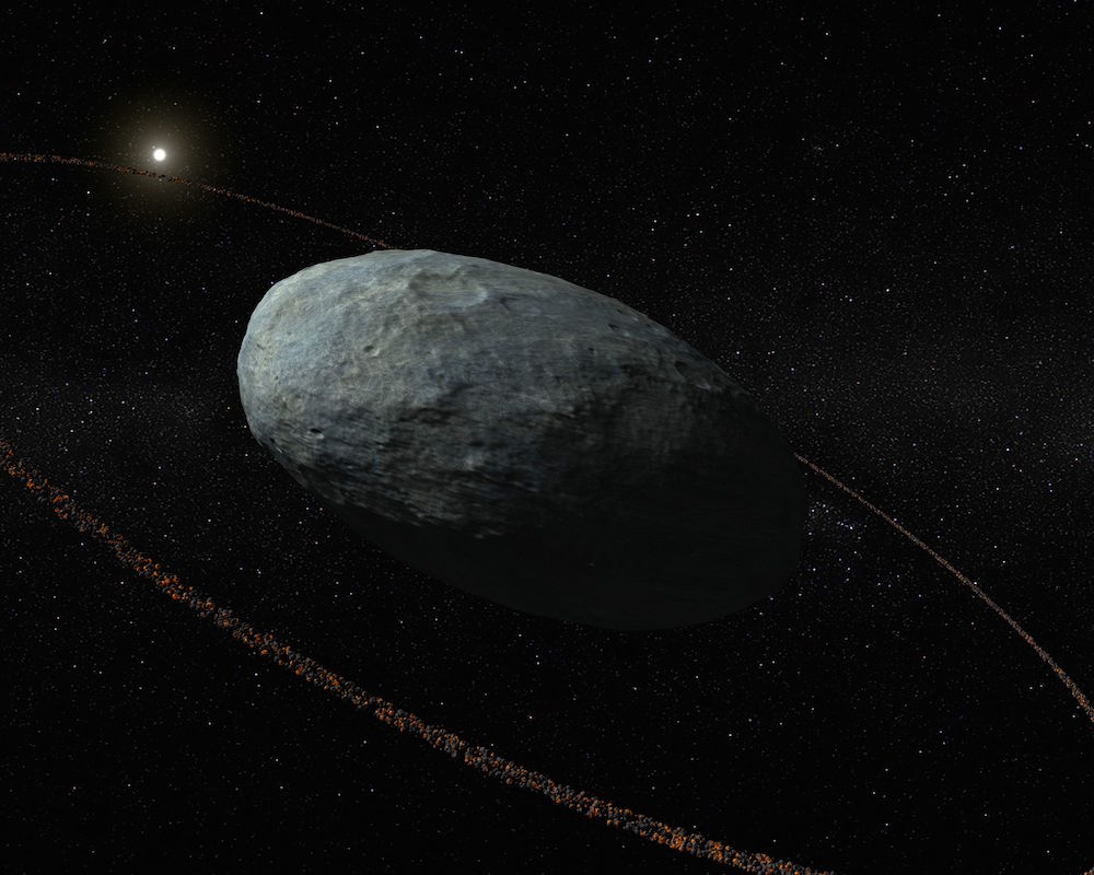 Una recreación artística del planeta enano Haumea y su anillo.