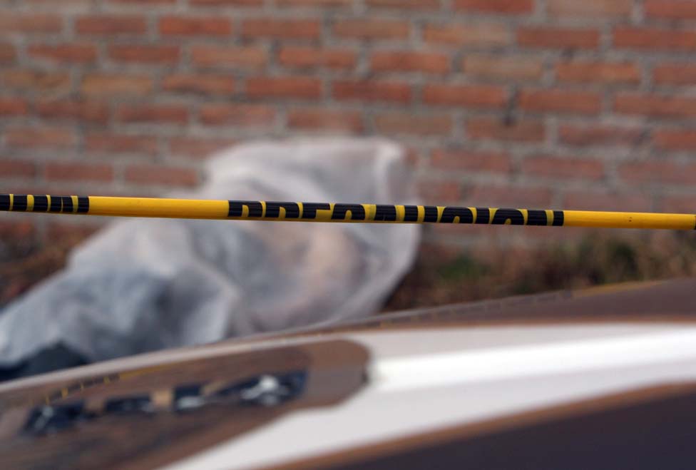 La víctima presentaba un disparo en la nuca.