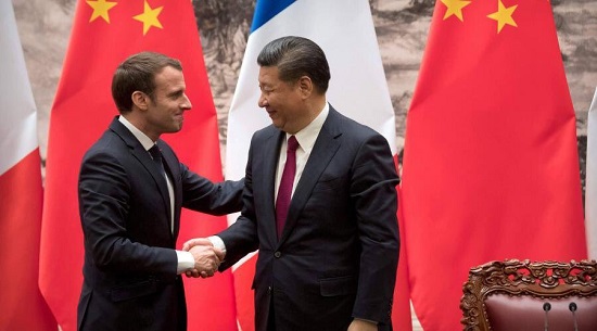 Los mandatarios de Francia y China durante el anuncio del acuerdo.