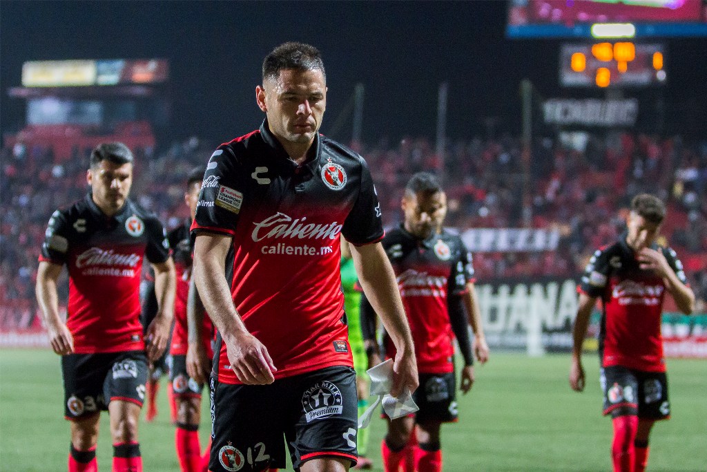 Jugadores de Xolos en lamento 