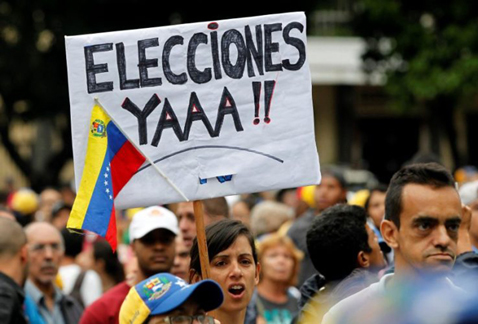 Miles de venezolanos salen a las calles en Caracas para exigir elecciones limpias este 20 de mayo. (Reuters)
