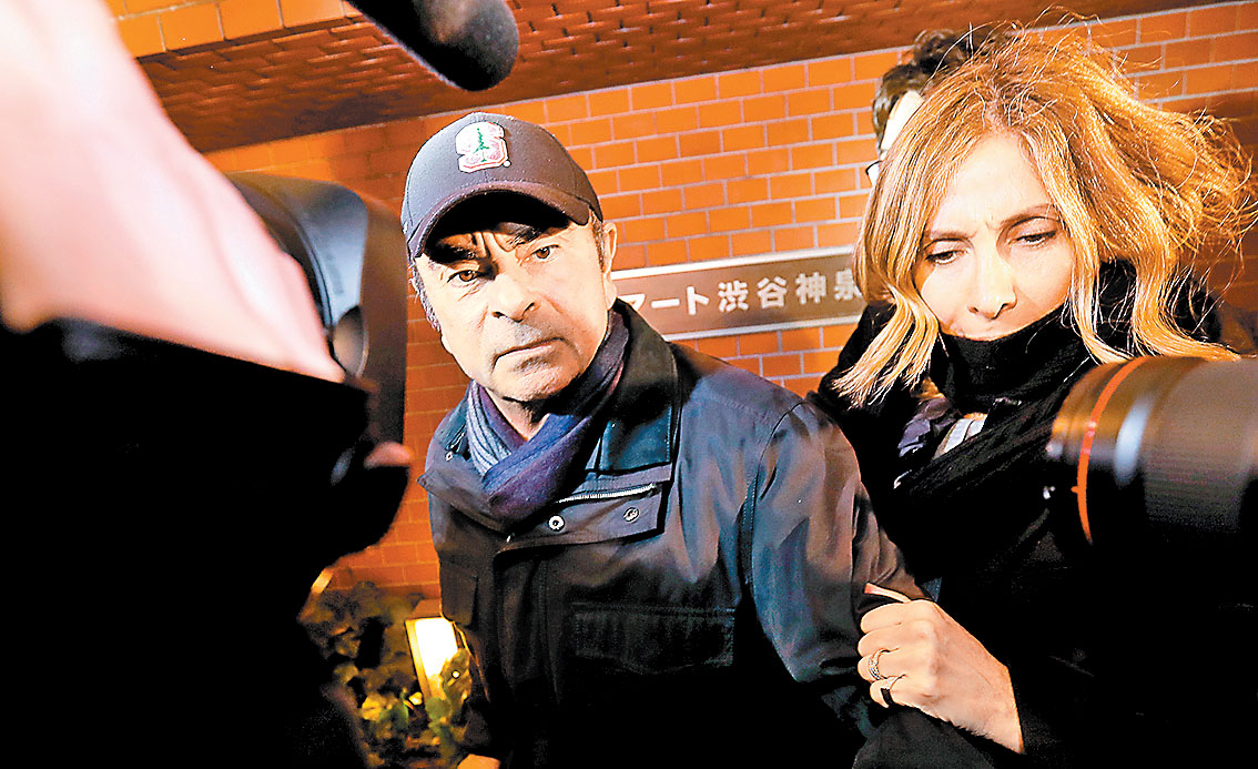 Carole estuvo con su marido en el cuarto arresto. (Issei Kato/Reuters)