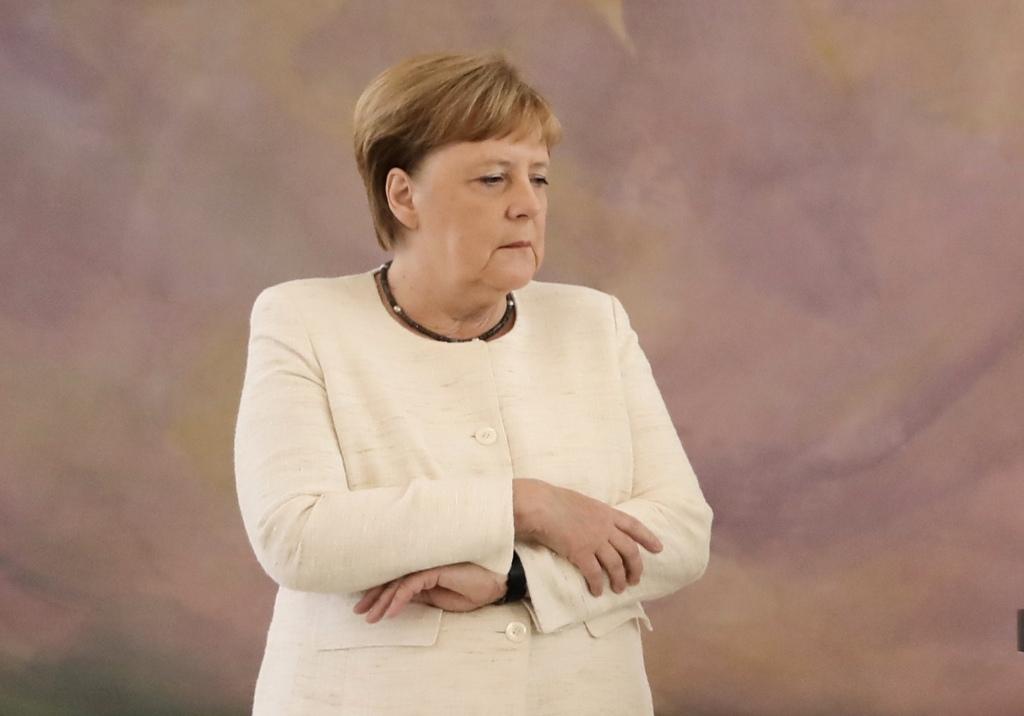 Merkel tembló durante unos dos minutos. AFP