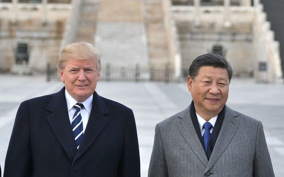 Trump y Xi durante una reunión, en Pekín, en 2017. (Archivo)