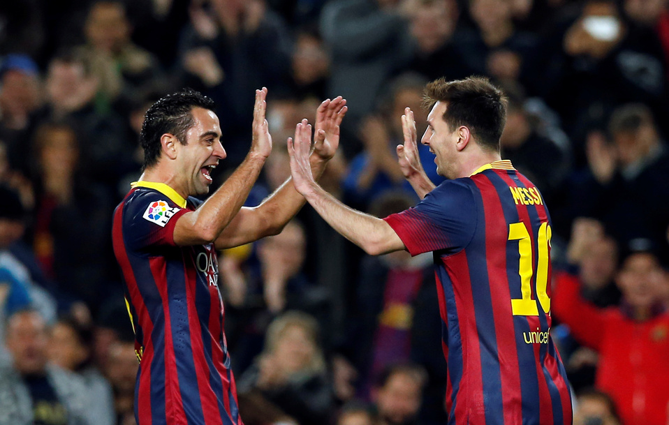 Lionel Messi y Xavi Hernández (Reuters)