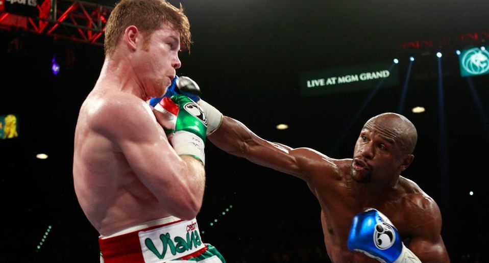 Floyd Mayweather y Saúl Canelo Álvarez (Reuters)