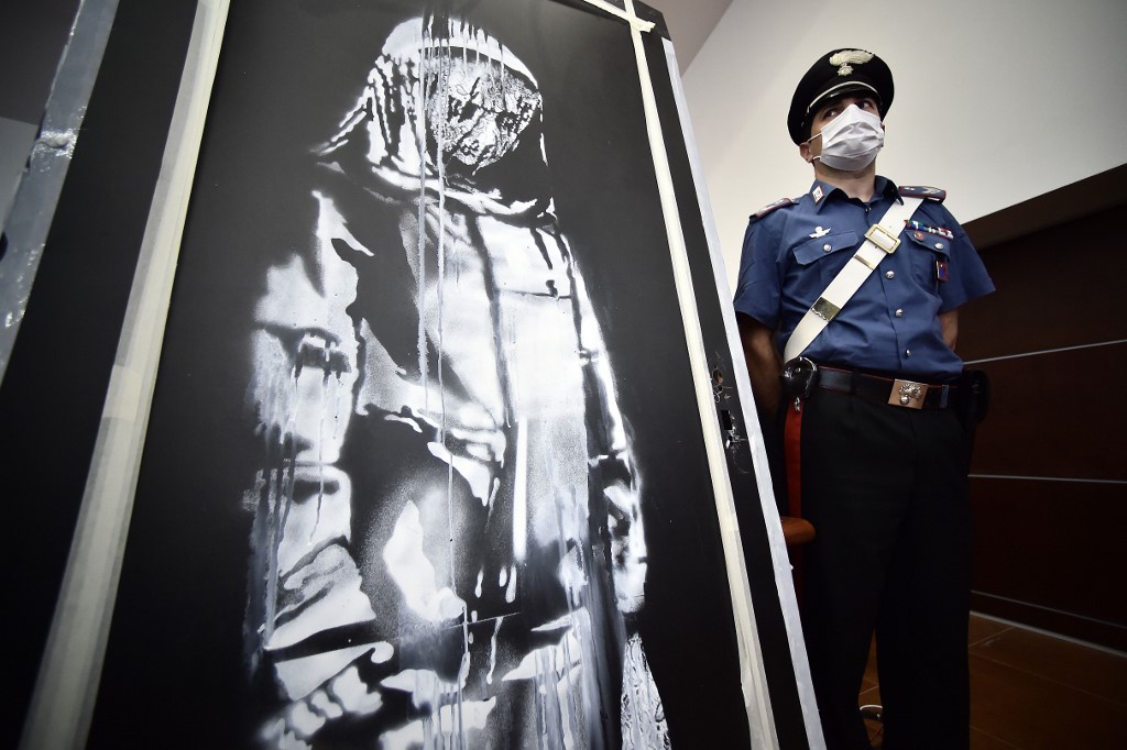 Termina viaja de la obra robada de Banksy en Italia. (AFP)