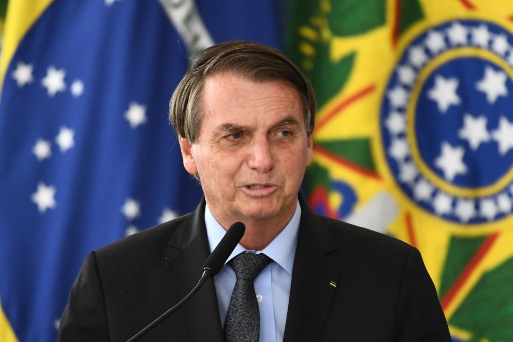Jair Bolsonaro afirmó que prefiere la reapertura total económica para evitar el aumento de la pobreza. (AFP)