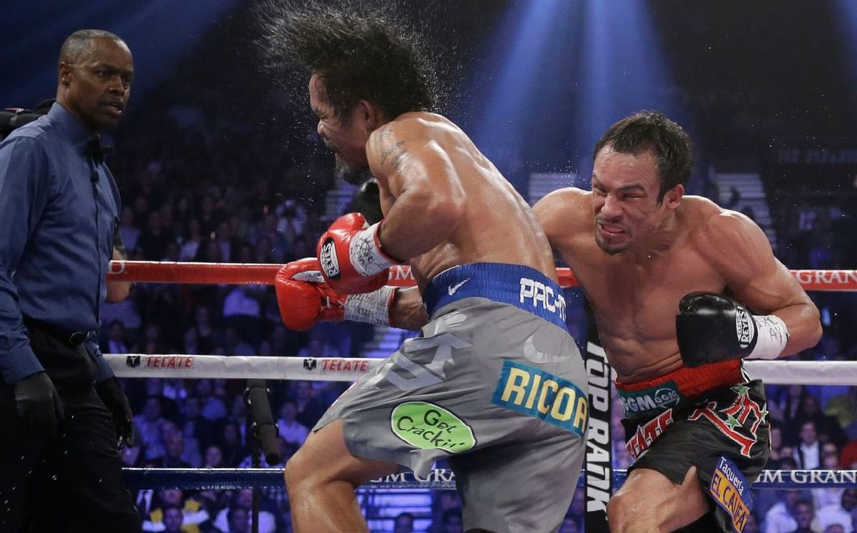 https://images.milenio.com/kPojFsw1wS9XWCkAMDf6LYSRf9Y=/958x596/uploads/media/2021/09/29/ko-juan-manuel-marquez-pacquiao_0_103_1200_746.jpg