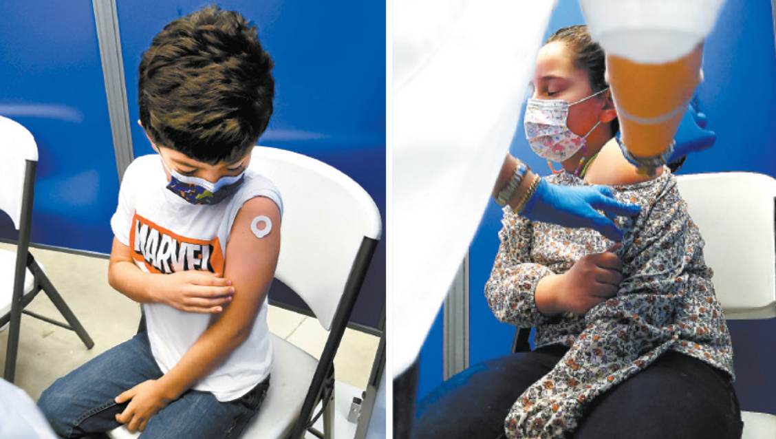Patricio y María, de 9 y 7 años, respectivamente, ya recibieron su dosis de la vacuna Pfizer en una farmacia de Edimburg, al sur de Texas. Especial