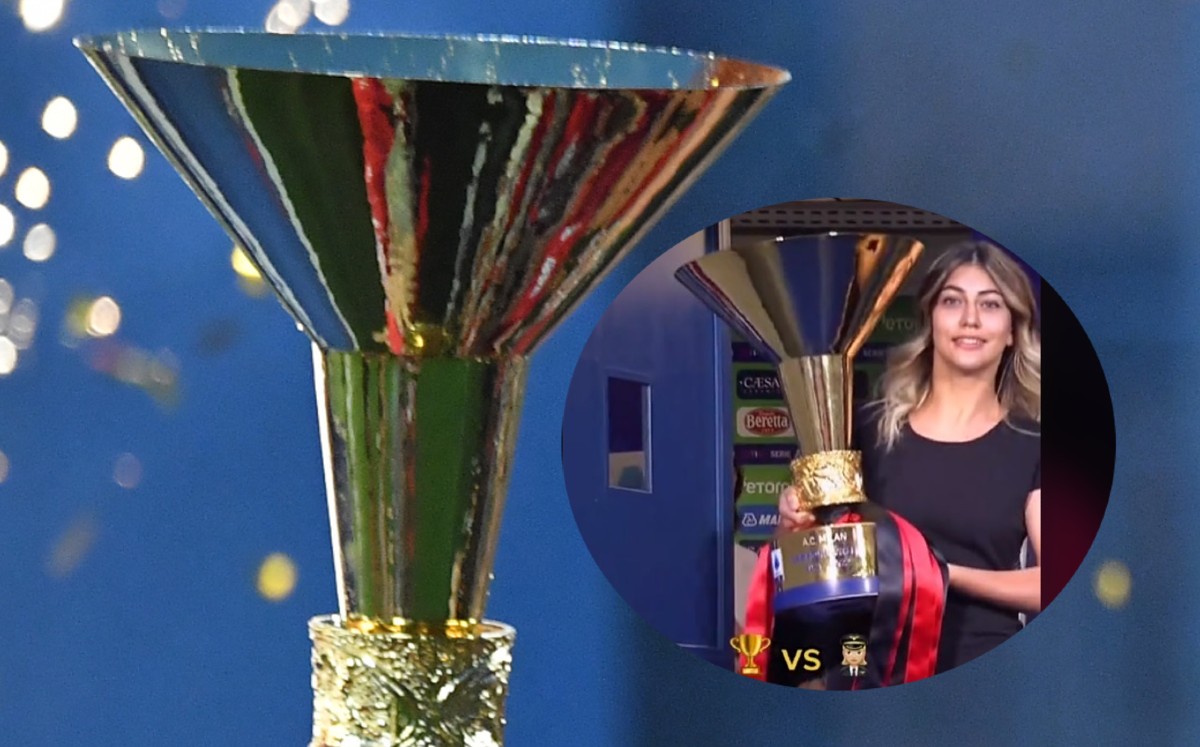 Modelo golpea trofeo de campeón del AC Milan (AFP)