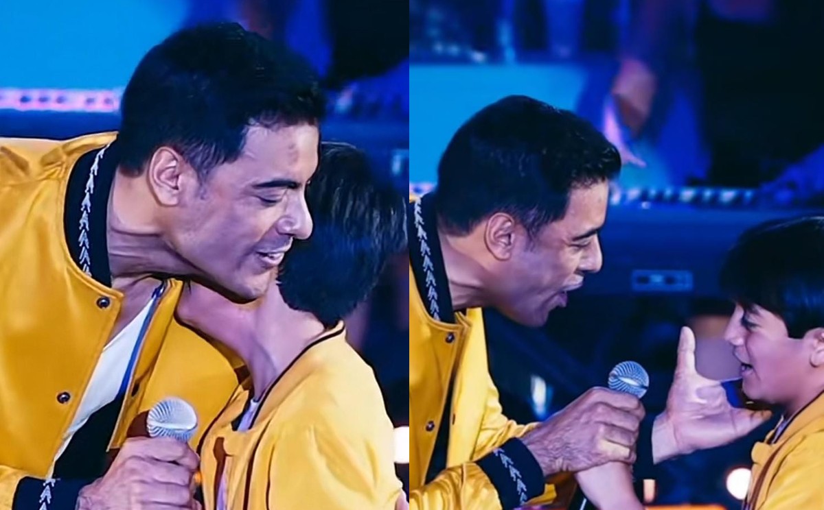 Carlos Rivera comparte escenario con fan. | Especial