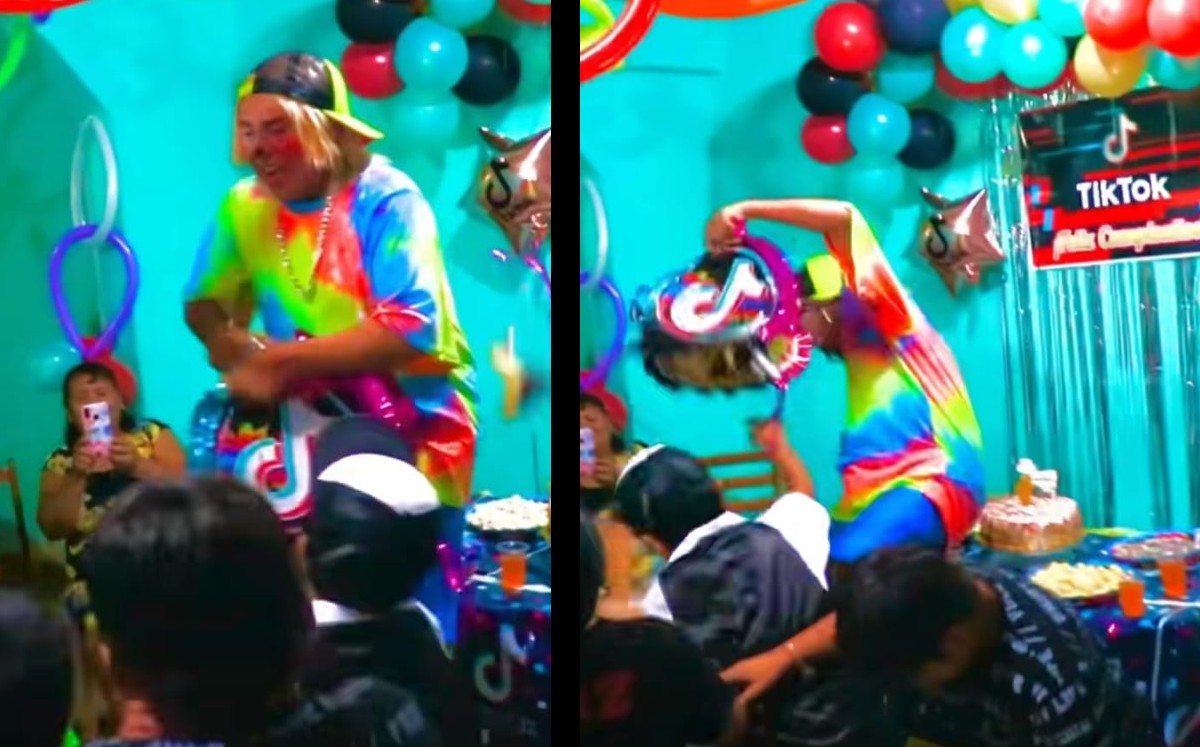 Payaso se cae sobre pastel en fiesta infantil. | ESPECIAL