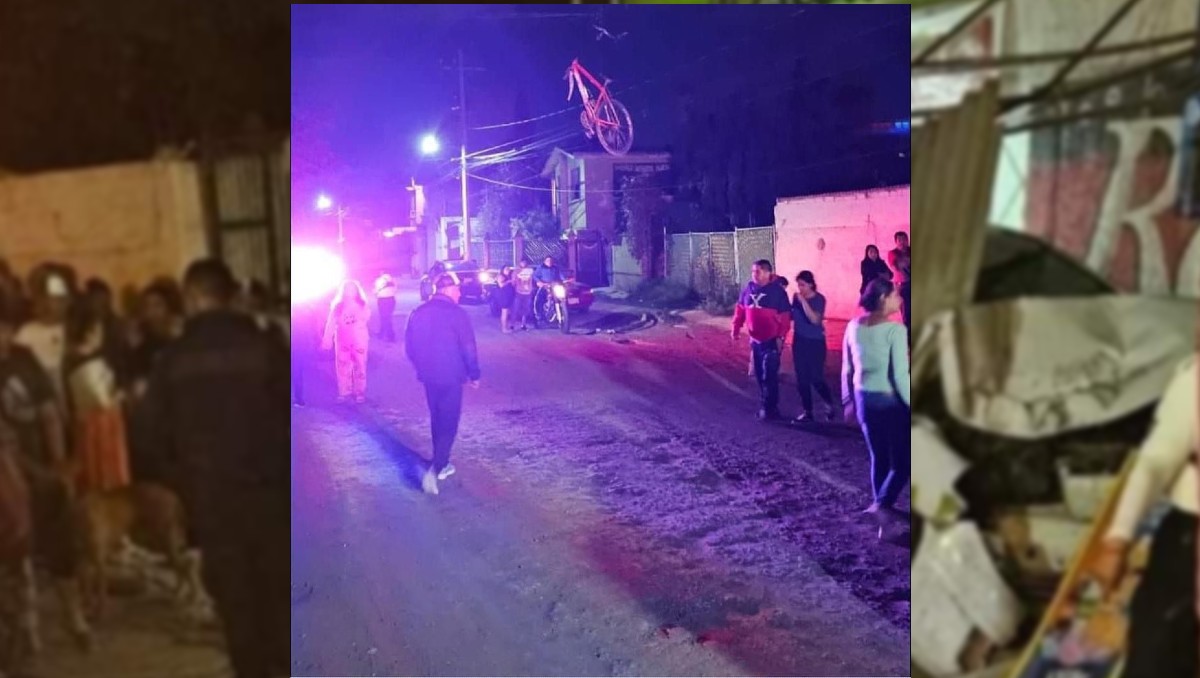 Policías y vecinos en el lugar del accidente donde falleció el ciclista (Especial)