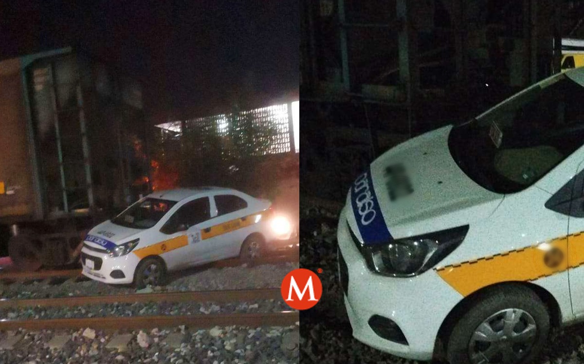 Taxi fue arrastrado por el tren en Tampico