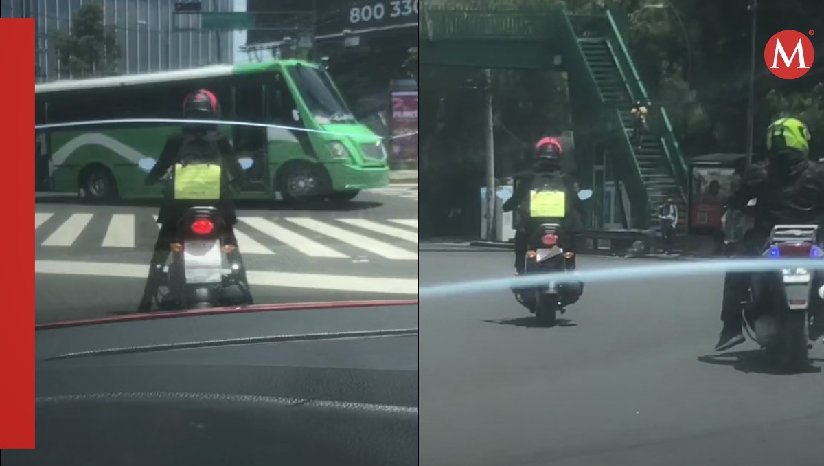 Motociclista con cómico cartel | Captura