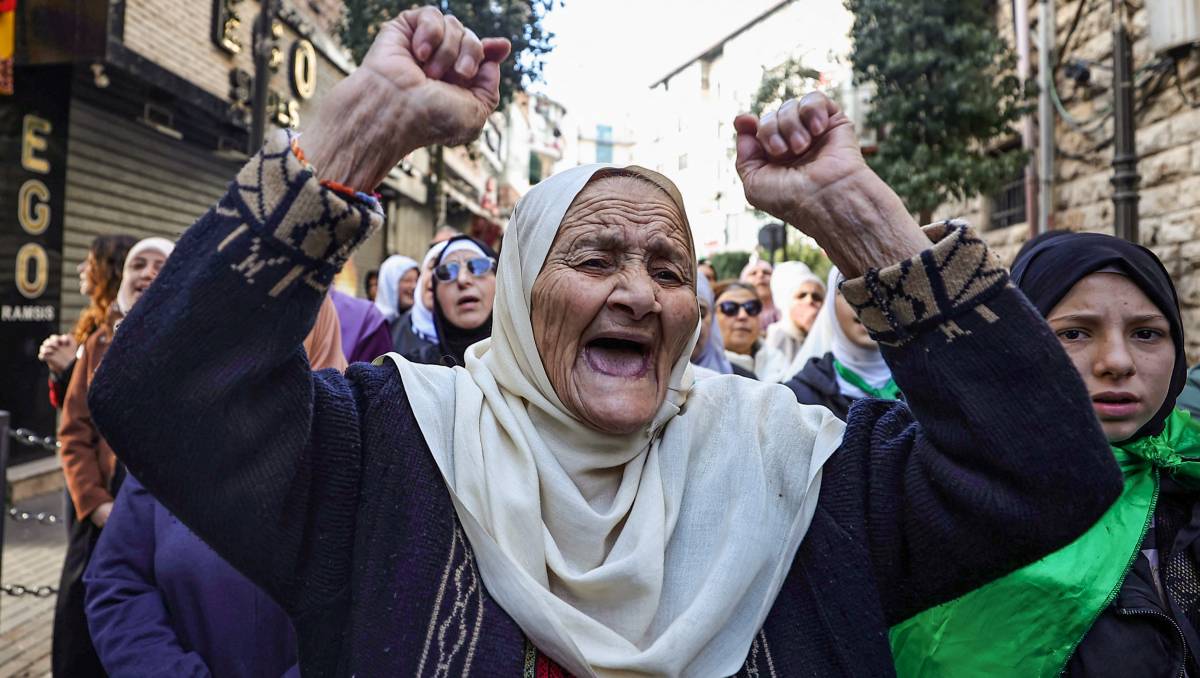 Mujer palestina en una protesta contra la guerra desde Cisjordania | AFP