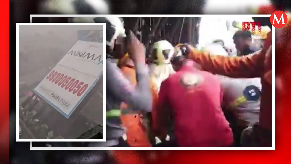 Viento tormentosos desploman valla de publicidad sobre gasolinera, India  / ARCHIVO