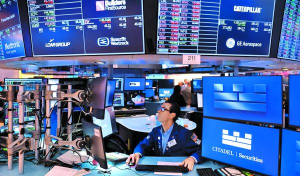 En Wall Street el índice Nasdaq cerró con una caída de 0.30 por ciento. MICHAEL M. SANTIAGO/AFP