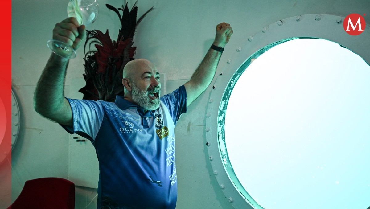El hombre celebrando su récord | AFP