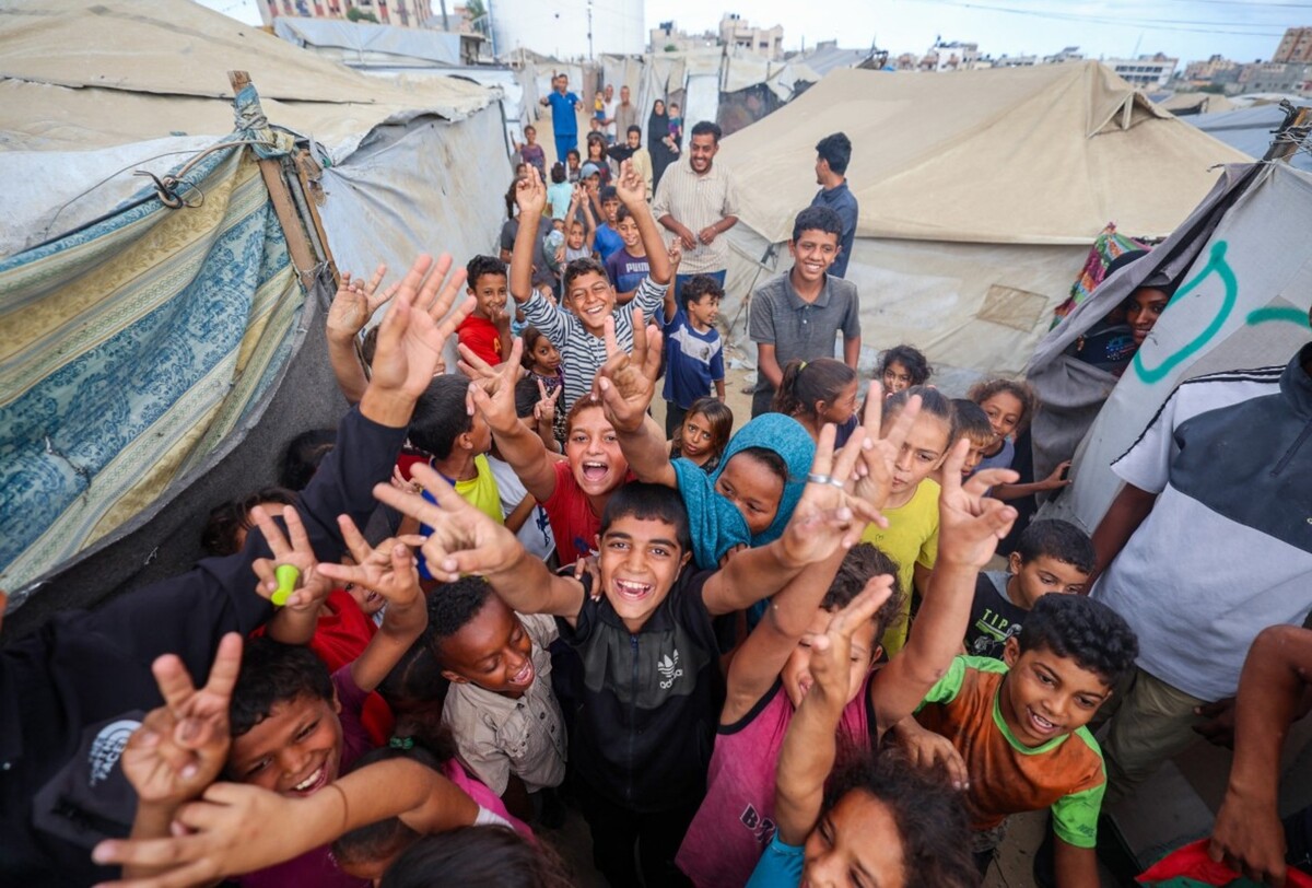 Niños palestinos celebran el fin de la pesadilla. | AFP