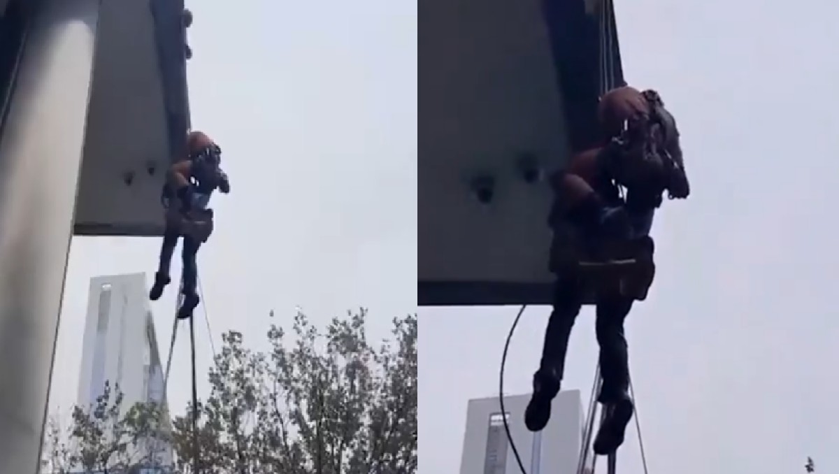 Rescatan a limpia vidrios atrapado por fuertes vientos. | FOTO: Redes sociales
