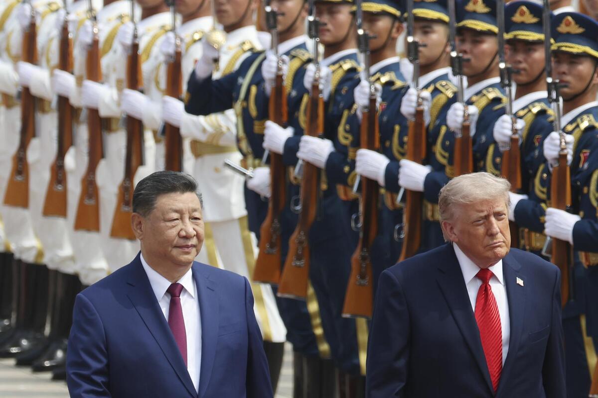 El presidente chino Xi Jinping inspecciona una guardia de honor junto al presidente estadunidense Donald Trump. | EFE
