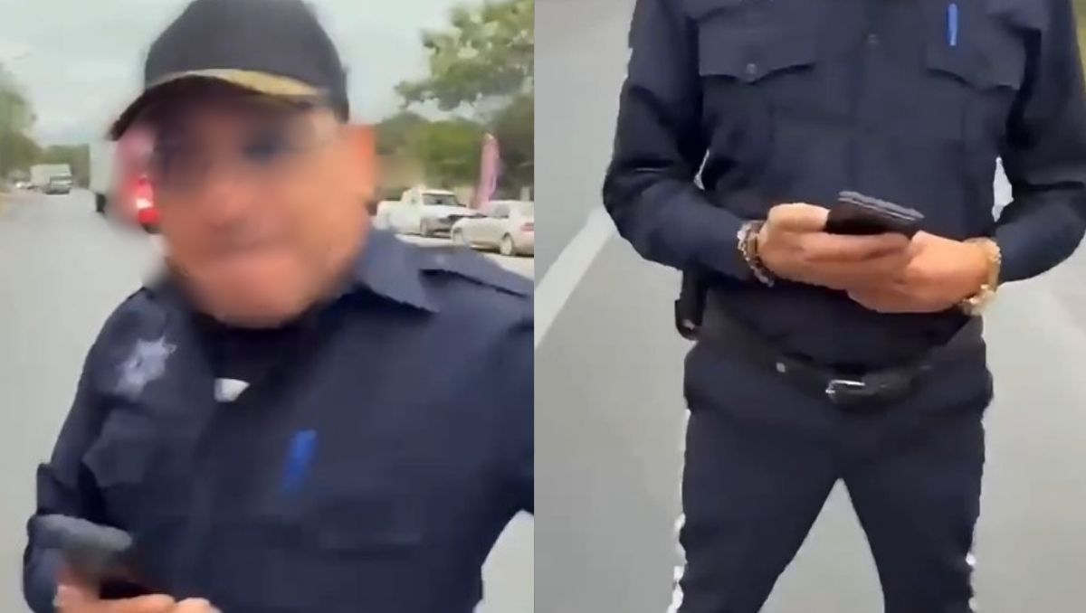 El elemento policiaco golpeó el teléfono celular con el que lo grababan. Foto: Especial
